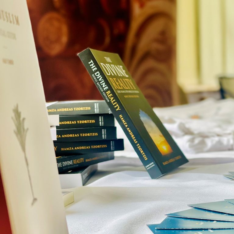 IMG_6071 Copies of The Divine Reality on a table